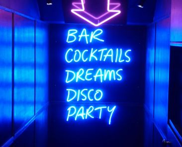 neon sign: Bar, Cocktails, Dreams, DIsco, Party