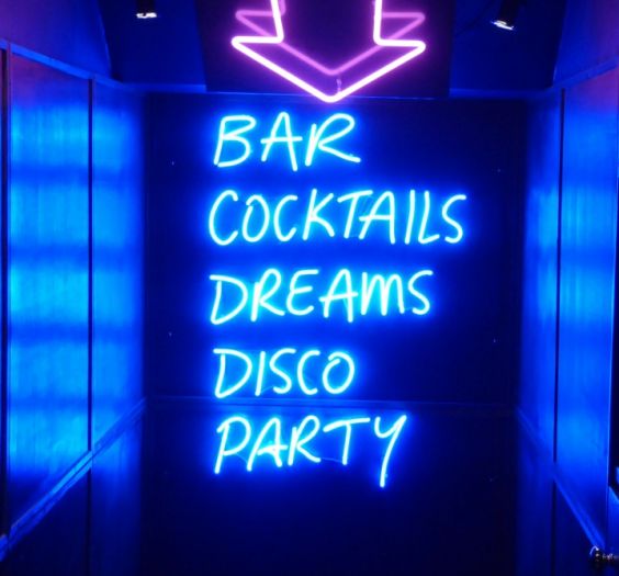 neon sign: Bar, Cocktails, Dreams, DIsco, Party