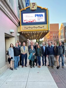 Susan Carlock with a group of members of the Precision Metalforming Association