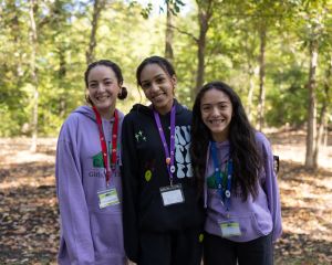 young women smiling for the camera outside