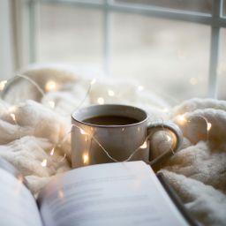 A book and a cup of coffee.