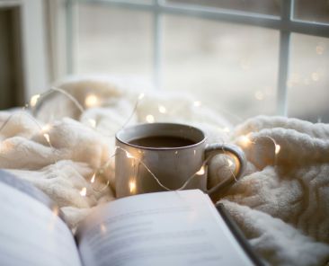 A book and a cup of coffee.