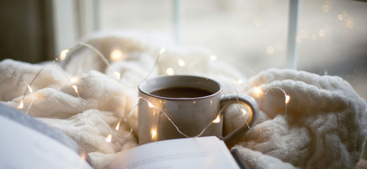 A book and a cup of coffee.