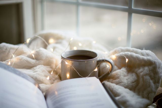 A book and a cup of coffee.