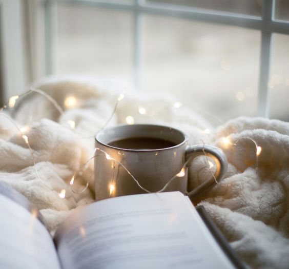 A book and a cup of coffee.