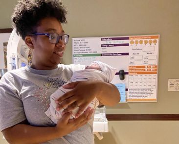 Joslyn Cunningham holding a baby