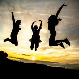 Mental Health Featured Image - Three people jumping in the air.