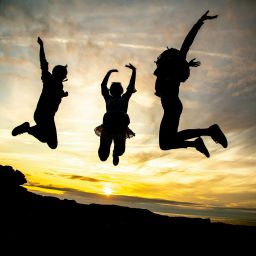 Mental Health Featured Image - Three people jumping in the air.