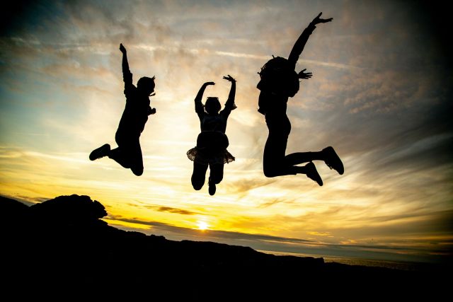 Mental Health Featured Image - Three people jumping in the air.