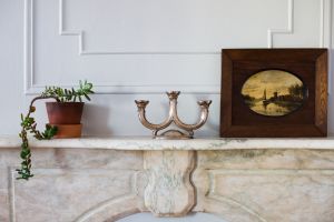 Mantle with Art on it.