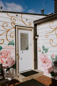 Floral mural outside Armonía Life Design in Fishers. 
