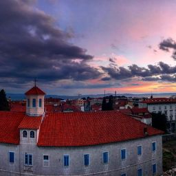 Sunset over a building.
