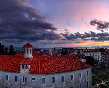 Sunset over a building.