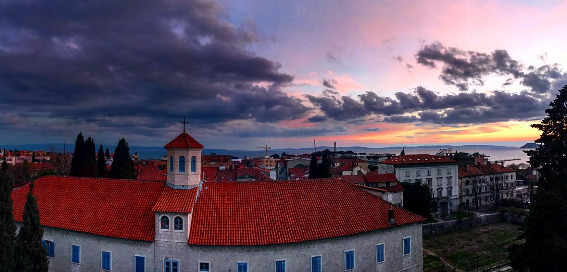 Sunset over a building.