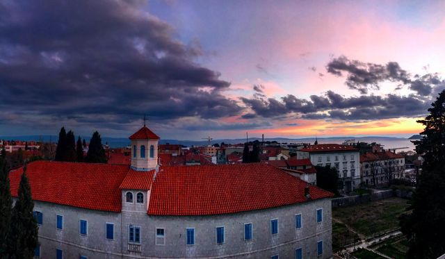 Sunset over a building.