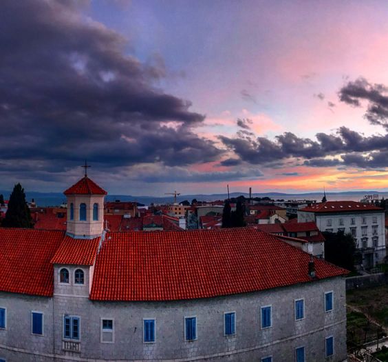 Sunset over a building.