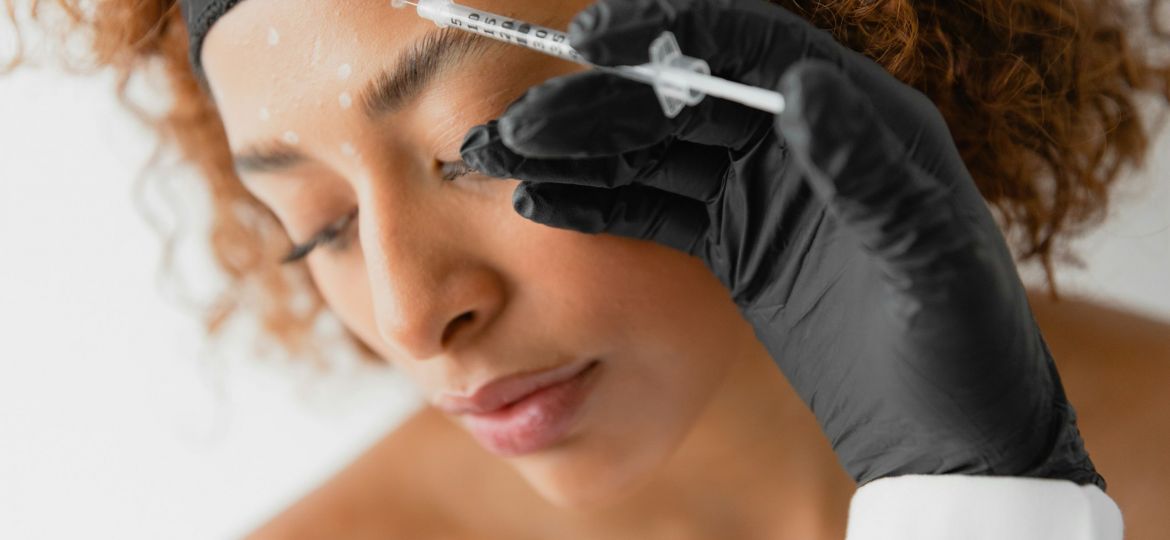 Woman getting a Botox injection.