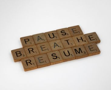 Scrabble Letters that spell out PAUSE, BREATHE, and RESUME.