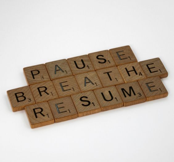 Scrabble Letters that spell out PAUSE, BREATHE, and RESUME.