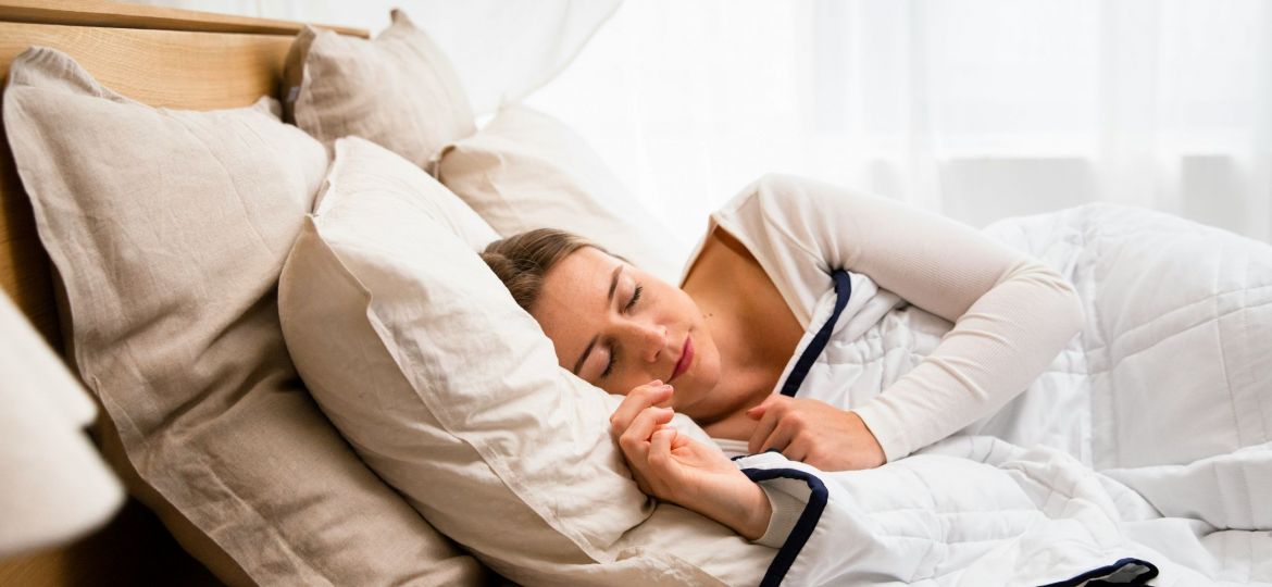 Person sleeping in bed.