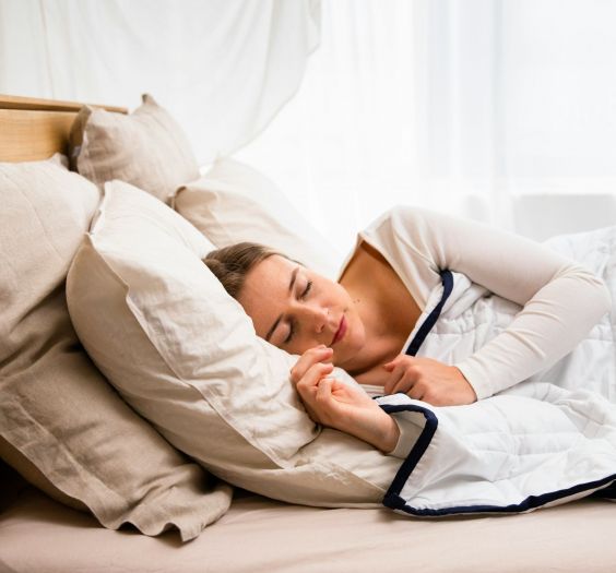 Person sleeping in bed.