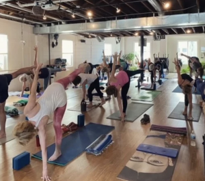 Blossom Yoga studio with classroom of students