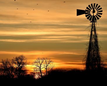 Windmill against a sunset sky