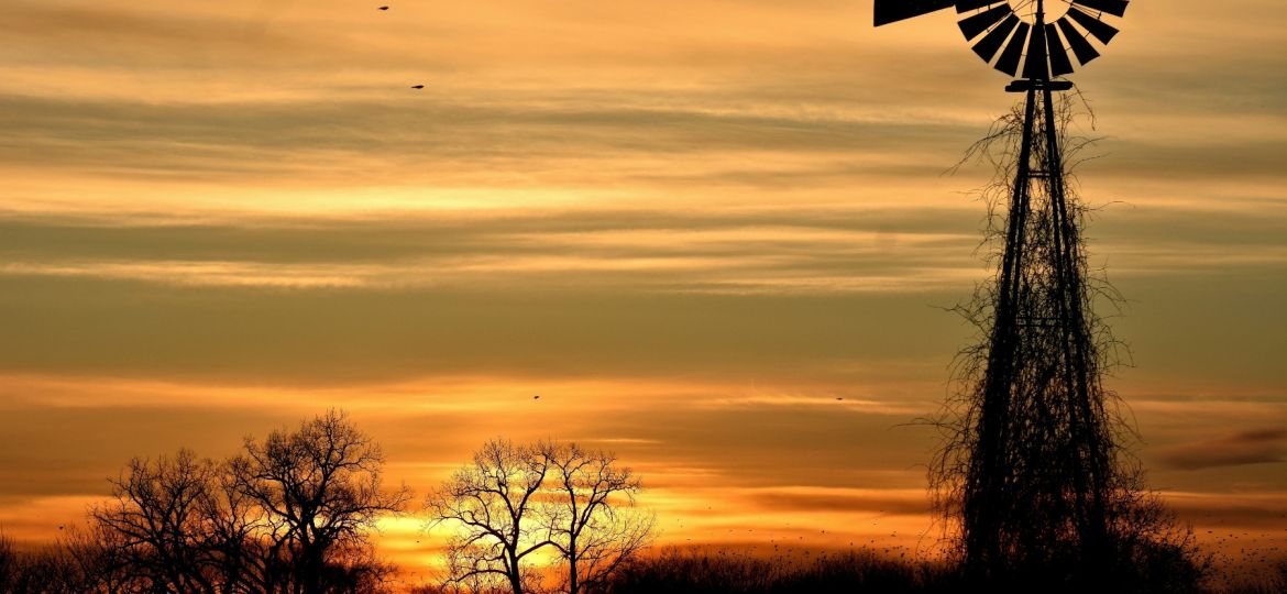 Windmill against a sunset sky