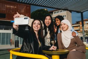 A group of women taking a selfie together