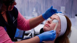 a woman with her eyes covered receiving a facial, eye treatment at Alternate View