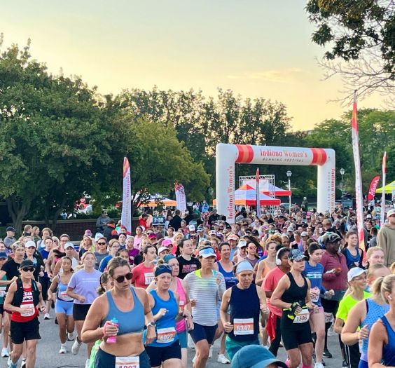 a group of women running a marathon