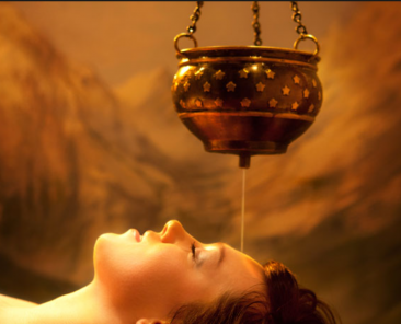 Shirodhara therapy - woman lying down as oil drips on her forehead